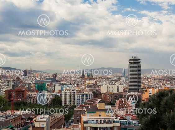 Barcelona city under cloudy sky overview