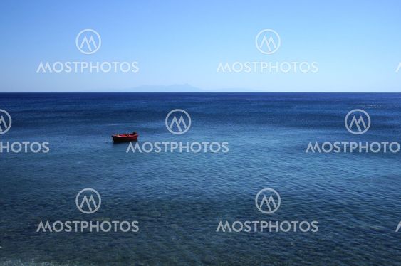 small boat alone on the ocean