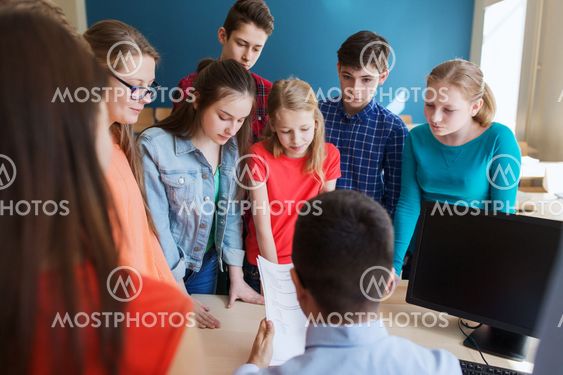 group of students and teacher with tests at school