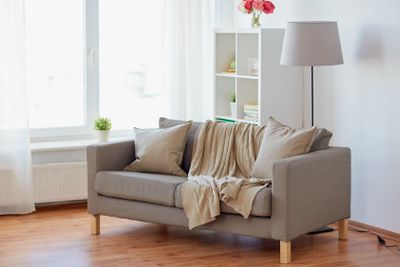 sofa with cushions at cozy home living room