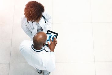 Doctor xray and hospital with tablet, scan results and...