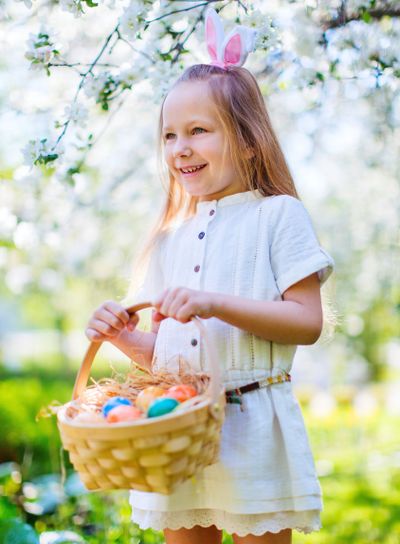 Little girl playing with Easter eggs