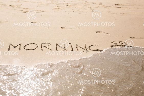 Abstract hand writing on the sand word Morning