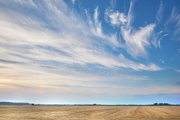 Blue sky, dessert or wheat field with clouds of...