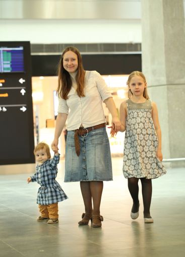 Happy family. Mother and children indoors portrait