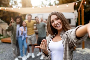 Lovely Caucasian woman taking selfie with her...