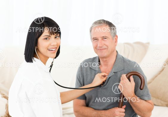 Nurse with her patient looking at the camera