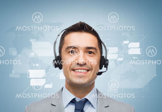 smiling businessman in headset