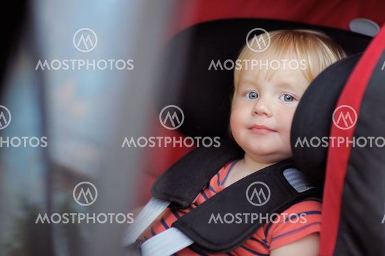 Toddler boy in car seat