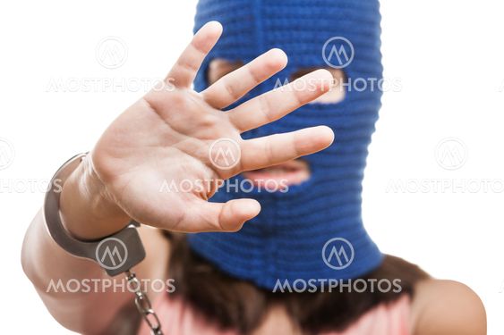 Woman in balaclava hiding face