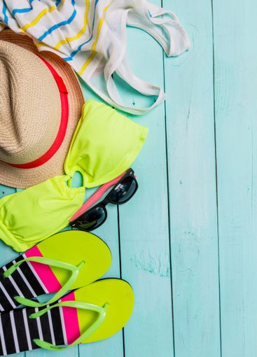 Beach accessories with yellow swimming suit,sunglasses...