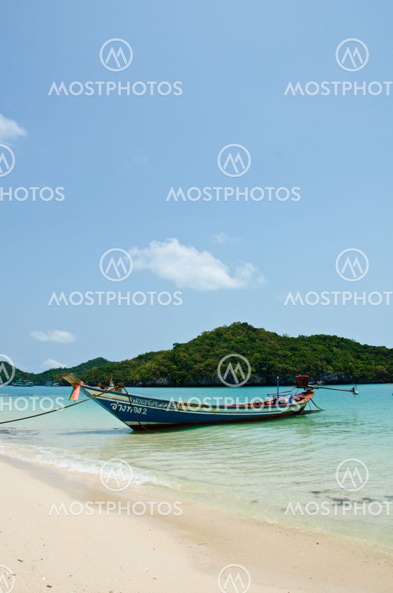 long tail boat on the beach