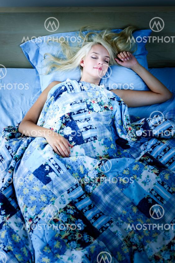 Woman sleeping in bed at night