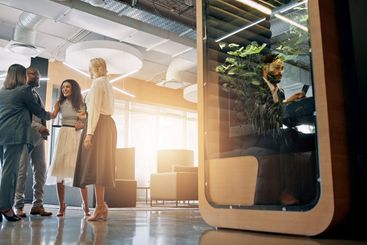 Lobby, corporate and business people with cubicle in...