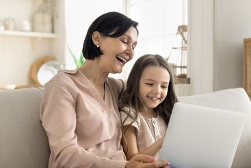 Laughing mature grandma little granddaughter exploring...