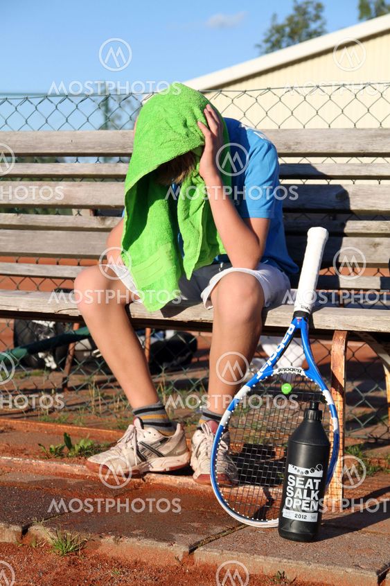 Tennis guy with a towel over the head