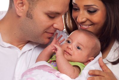 Mixed Race Young Couple with Newborn Baby
