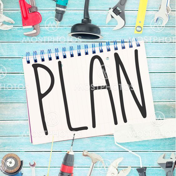 Plan against tools and notepad on wooden background
