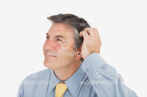 Businessman scratching head