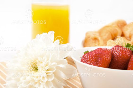 Breakfast with berries,orange juice and croissant