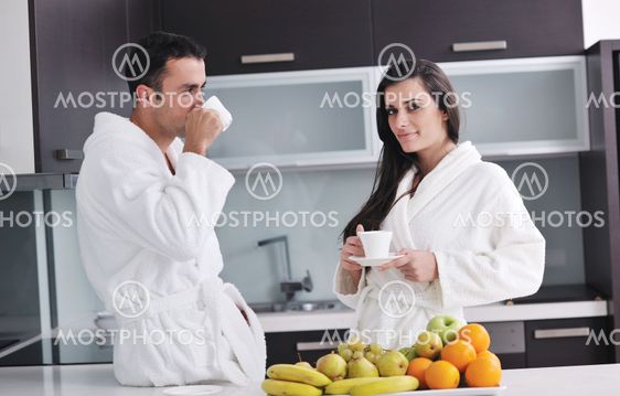 young couple have fun in modern kitchen