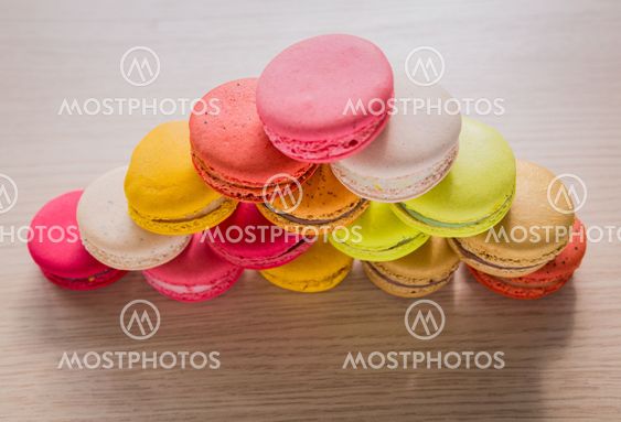 French colorful macarons on wood table