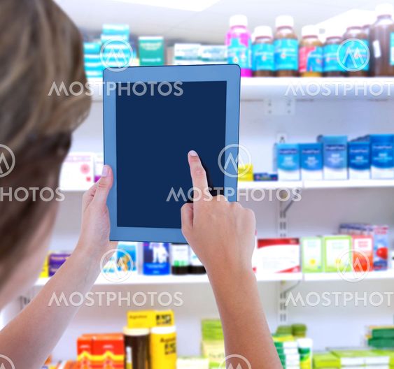 Composite image of woman using tablet pc