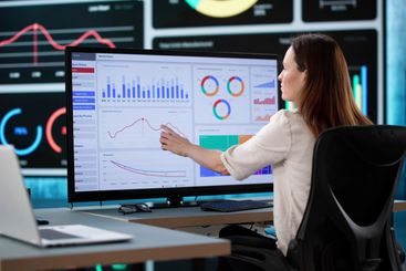 Female Caucasian Strategist Analyzing Real Time Business...