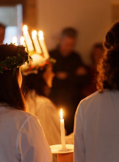 Lucia parade with singing girls and boys in white dresses...