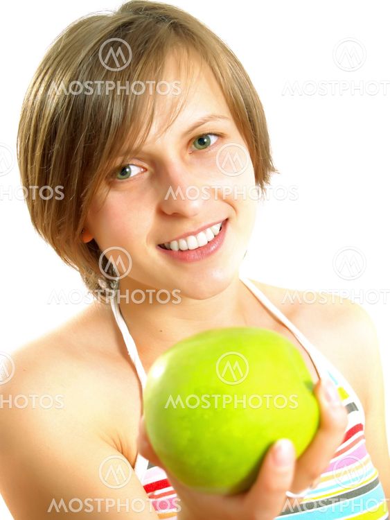 Cute girl giving a green apple