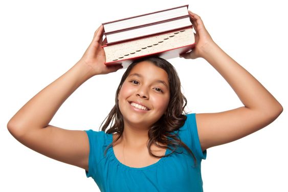 Pretty Hispanic Girl with Books on Her Head