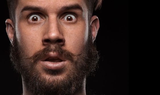 Close-up portrait of amazed guy