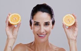 Portrait, orange and woman with skincare, wellness and...