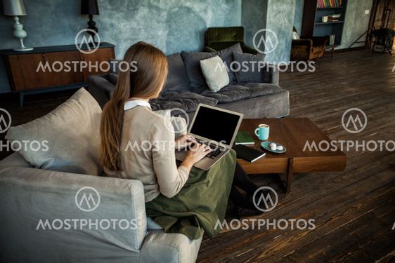Empty Screen Laptop in Female Hands at Home