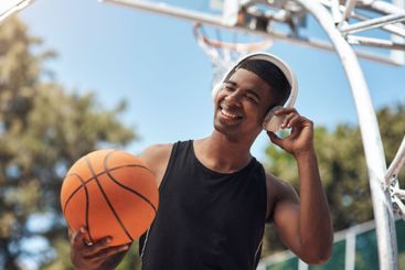 Basketball, man or headphones with ball outdoor for...