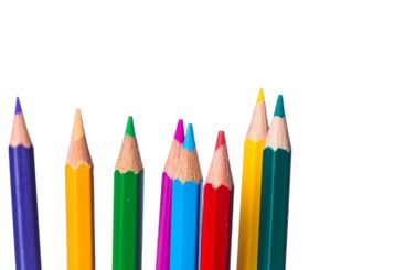 Colorful collection of sharpened pencils arranged on a...