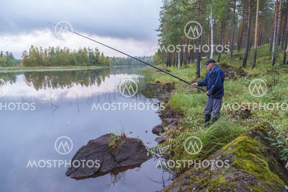 Man fishing at small lake
