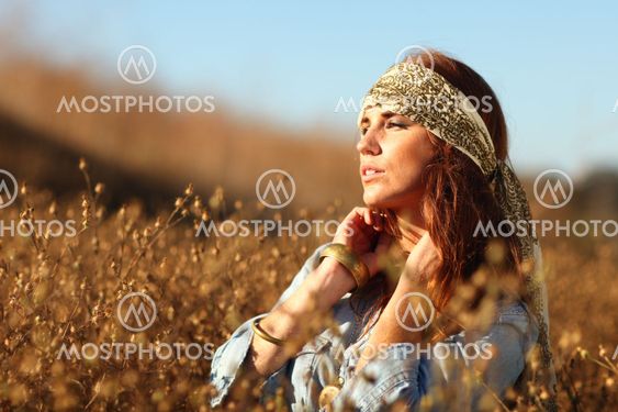 Beautiful Woman on a Field in Summertime