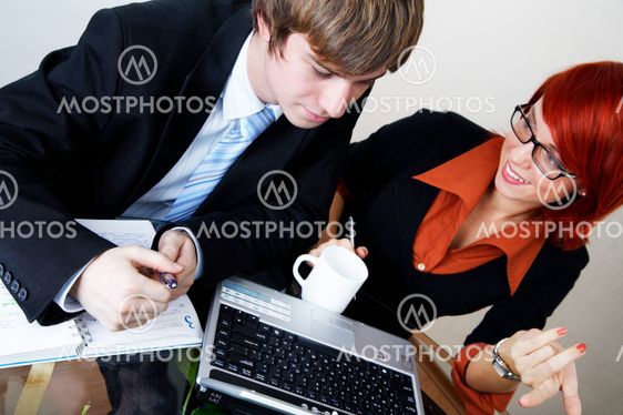 successful caucasian manager with young beautiful consultant