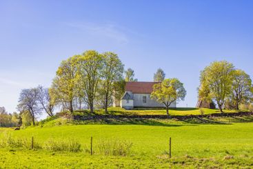 Idyllic old church on a hill in the Swedish countryside...