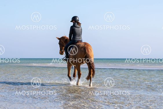 Riding on the beach