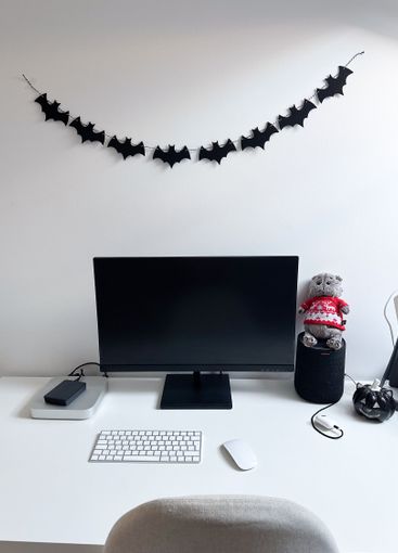 Clean and minimalistic home office desk decorated with...