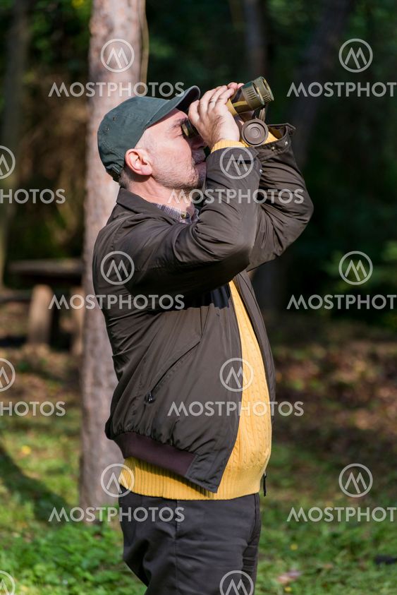 Senior man with binoculars