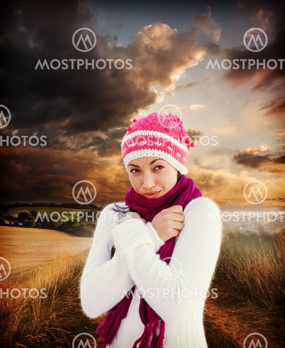 Composite image of attractive woman wearing warm clothes