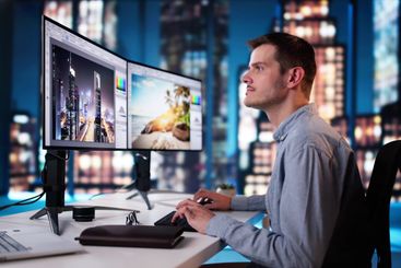 Graphic Designer Working On Computer Editing