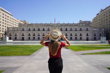 Tourism in Chile. Back view of tourist woman in Plaza de...