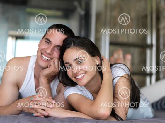 couple relax and have fun in bed