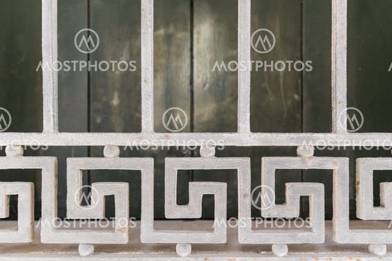 Detail of a white grid of a window.