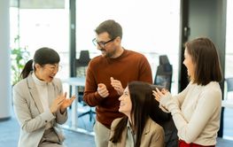 Team collaboration in a modern office environment during...