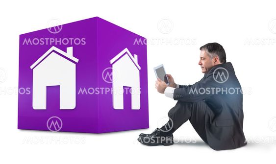 Composite image of mature businessman sitting using tablet